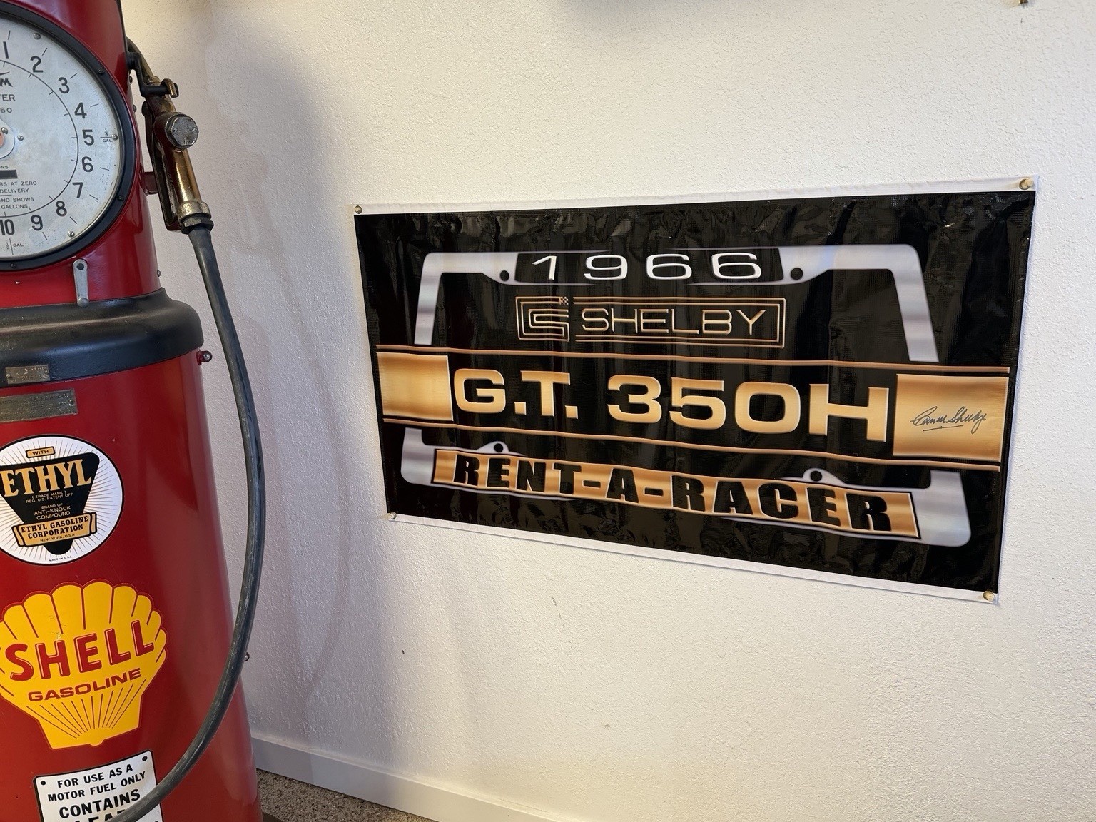 Carroll Shelby Signed GT350H “Rent-A-Racer” Banner (45”) w/ COA
